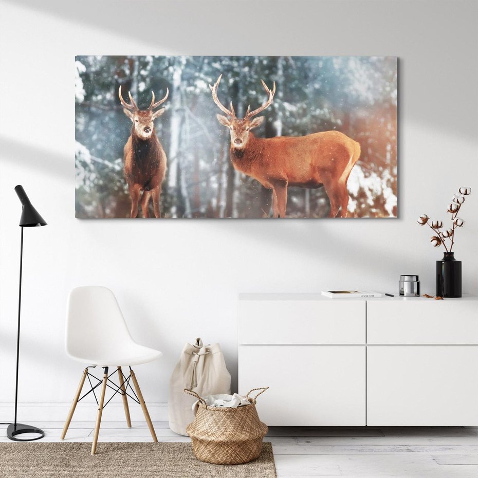 Obraz na płótnie 100x50 - Mroźne Spotkanie w Leśnej Krainie - dwa jelenie, zima