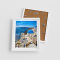 Plakat w ramie 40x50 - Urokliwy widok na Santorini - Santorini, widok - rama biała