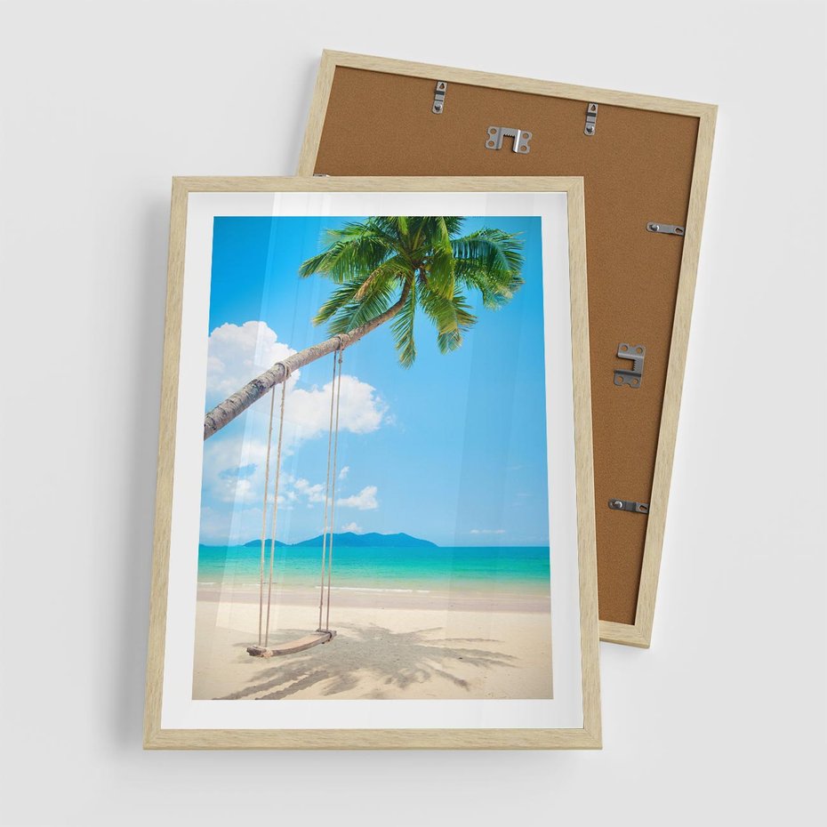 Plakat w ramie 50x70 - Hawajska palma i huśtawka na plaży - palma, huśtawka - rama drewno
