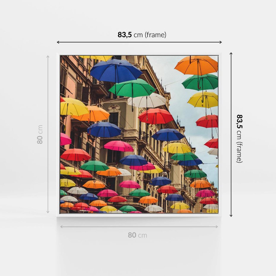 Obraz w ramie 80x80 - Barwna symfonia wyobraźni - fotografia, kolorowe parasolki podwieszone nad ulicą - rama biała