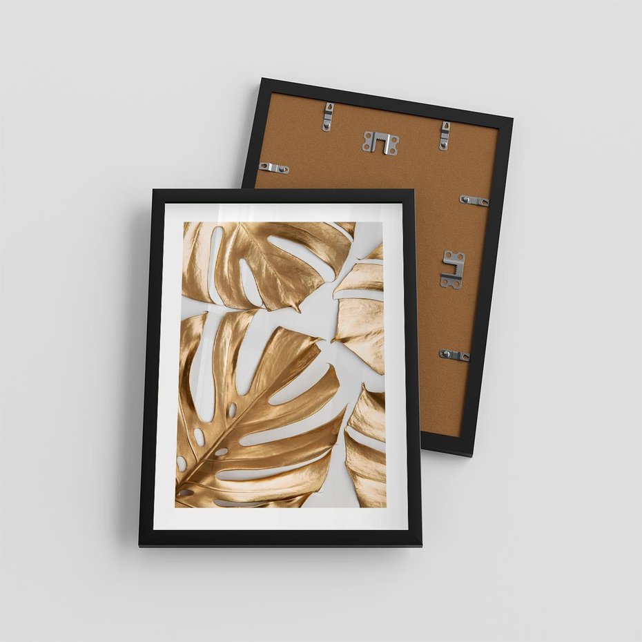 Plakat w ramie 30x40 - Złote Akcenty w Fotografii - złotel liście monstery, na białym tle - rama czarna