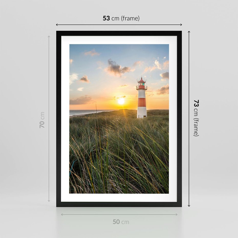 Plakat w ramie 50x70 - Magia latarni przy zachodzie - latarnia, zachód - rama czarna