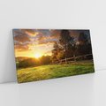 Obraz na płótnie 140x70 - Urok zachodu słońca na łące z drzewami - łąka, zachód