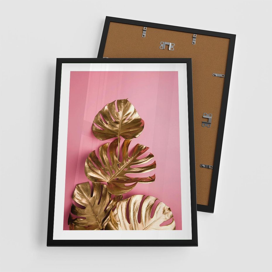 Plakat w ramie 50x70 - Złote Liście Monstery: Delikatność na Różowym Tle - złote liście monstery, różowe tło - rama czarna