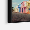 Obraz w ramie 50x50 - Ekspresja marzeń i tęsknot - pastelowe kolorowe budynki, wzdłuż ulicy - rama czarna