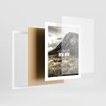 Plakat w ramie 40x50 - Biały Domek w Sepii: Wiejski Urok - domek w górach, kolory sepii - rama biała