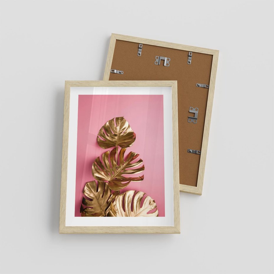 Plakat w ramie 30x40 - Złote Liście Monstery: Delikatność na Różowym Tle - złote liście monstery, różowe tło - rama drewno