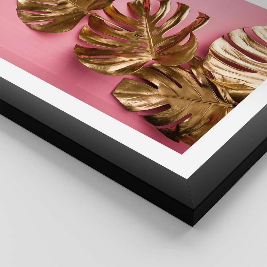 Plakat w ramie 40x50 - Złote Liście Monstery: Delikatność na Różowym Tle - złote liście monstery, różowe tło - rama czarna