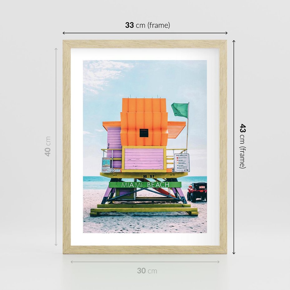 Plakat w ramie 30x40 - Plaża Miami w Słoneczny Dzień - domek ratownika, kolorowy - rama drewno