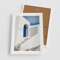 Plakat w ramie 50x70 - Powitanie Wyspy - Santorini, drzwi - rama biała