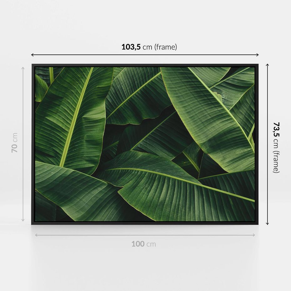 Obraz w ramie 100x70 - Zaklęta roślinna ekspresja - liście bananowca, gęsto ułożone - rama czarna
