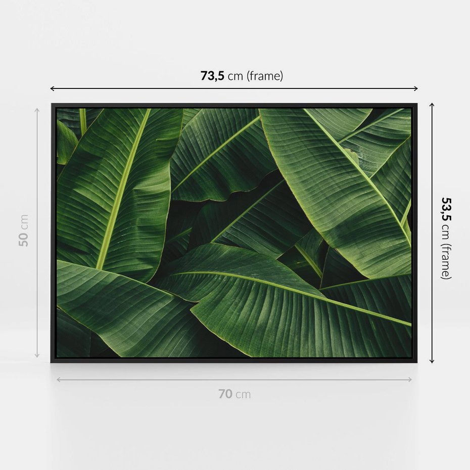 Obraz w ramie 70x50 - Zaklęta roślinna ekspresja - liście bananowca, gęsto ułożone - rama czarna