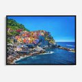Obraz w ramie 100x70 - Barwne Wybrzeże - nadmorskie miasto na klifie, kolorowe tęczowe budynki - rama czarna