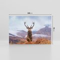 Obraz na płótnie 100x70 - Jeleń w Uśpionym Krajobrazie - jeleń na tle gór, ośnieżone góry