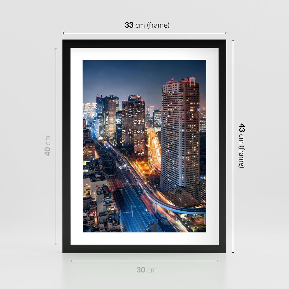 Plakat w ramie 30x40 - Miasto nocą z wieżowcami w tle - miasto, nocą - rama czarna