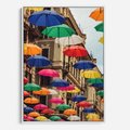 Obraz w ramie 50x70 - Barwna symfonia wyobraźni - fotografia, kolorowe parasolki podwieszone nad ulicą - rama biała