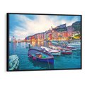 Obraz w ramie 100x70 - Tańczące kolory zachodu - nadmorskie kolorowe miast, kolorowe budynki na brzegu - rama czarna