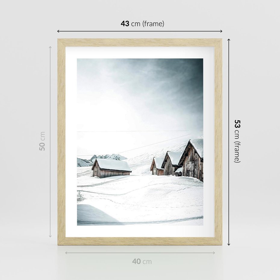 Plakat w ramie 40x50 - Zima w Domkach: Urok Śnieżnej Scenerii - domki w śnieżnym krajobrazie - rama drewno