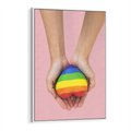 Obraz w ramie 70x100 - Miłość na Dłoniach - zdjęcie, dłonie trzymają ulepione tęczowe serce - rama biała