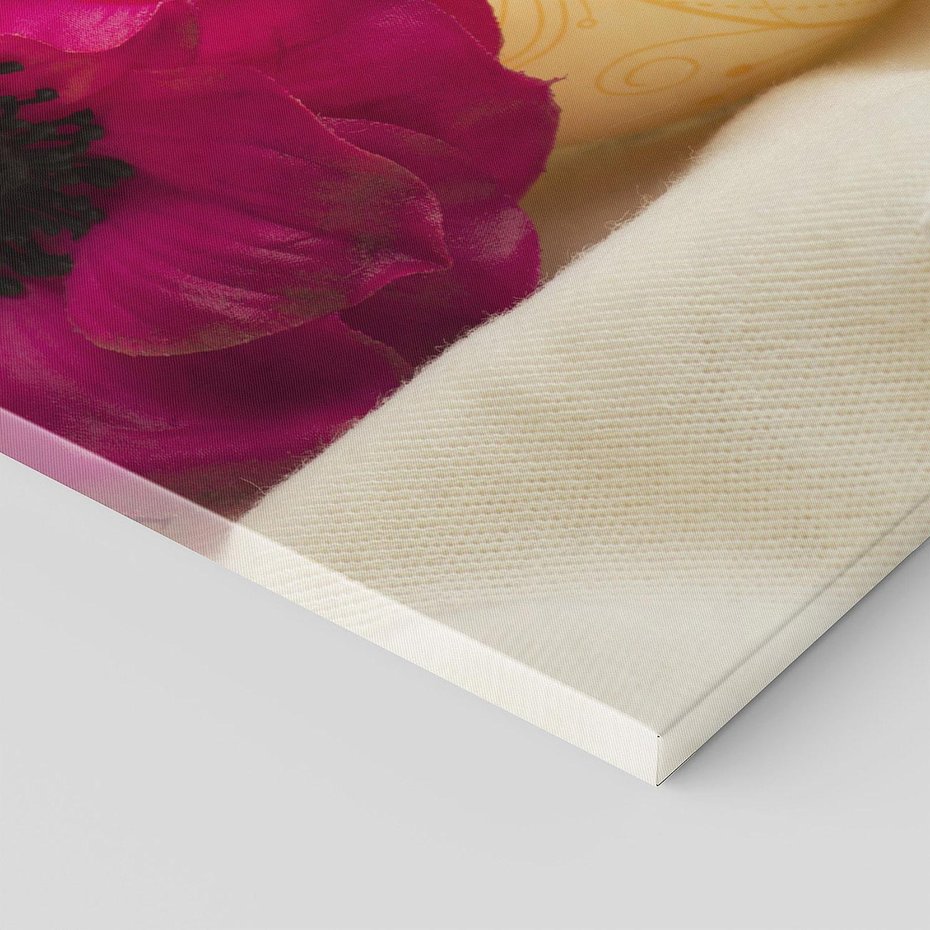 Obraz na płótnie 100x50 - Relaksujący moment: świeczki i kwiaty w SPA - świeczki, kwiat