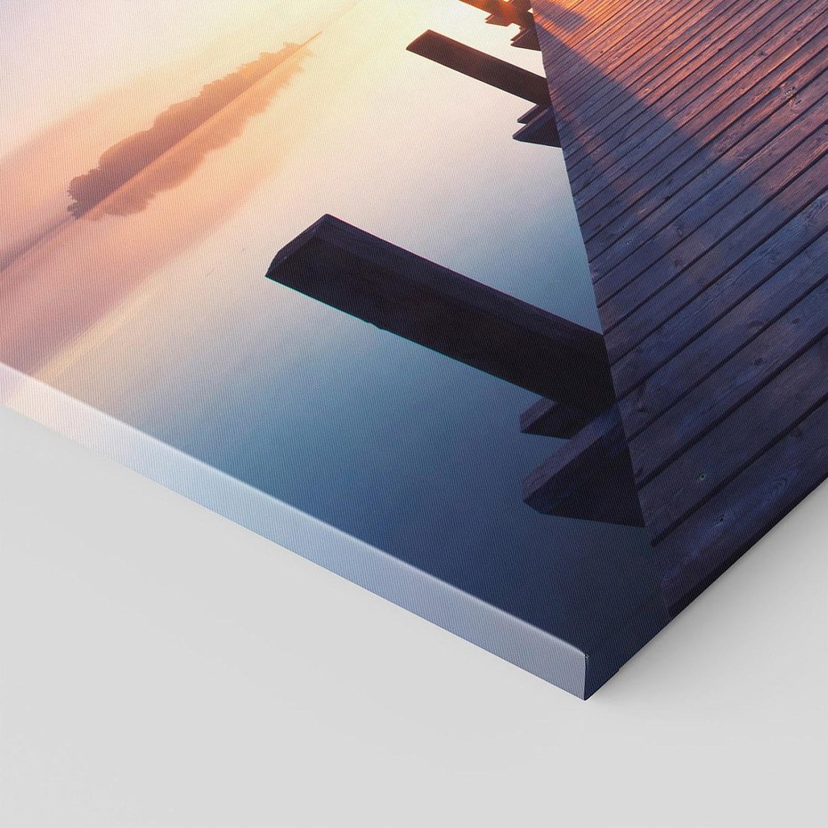 Obraz na płótnie 70x50 - Zachód słońca nad molo: Magia morza - molo, zachód słońca