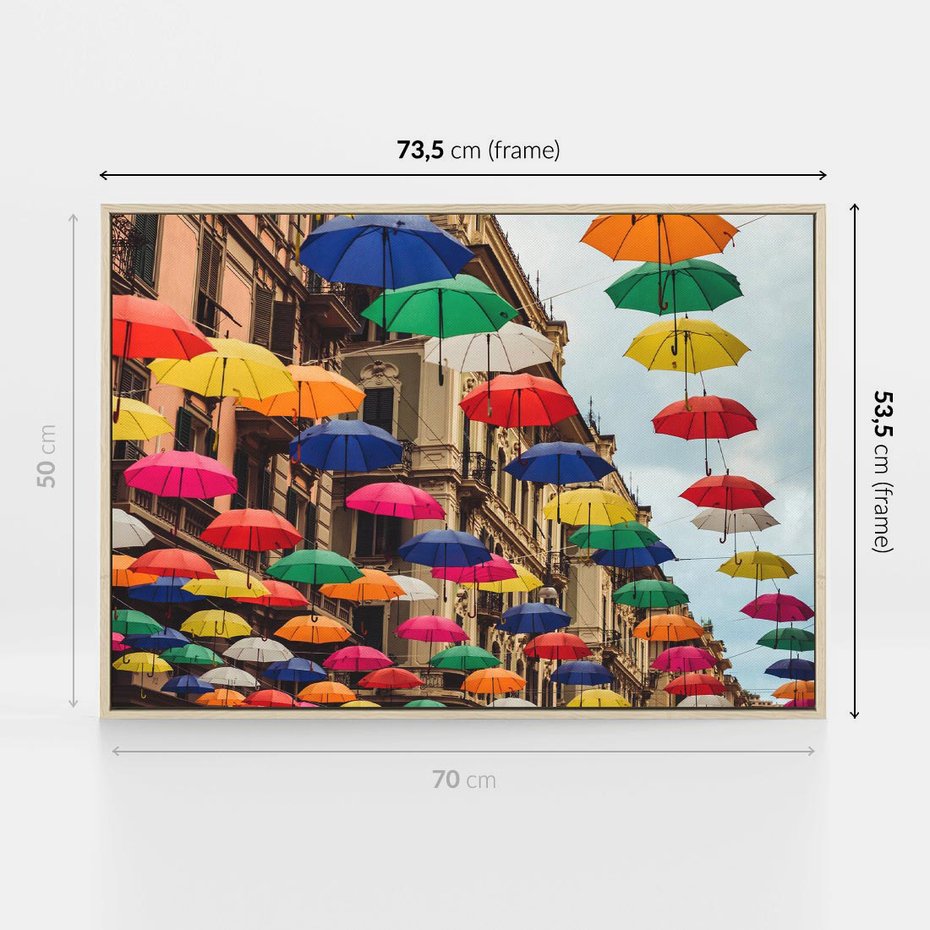 Obraz w ramie 70x50 - Barwna symfonia wyobraźni - fotografia, kolorowe parasolki podwieszone nad ulicą - rama drewno