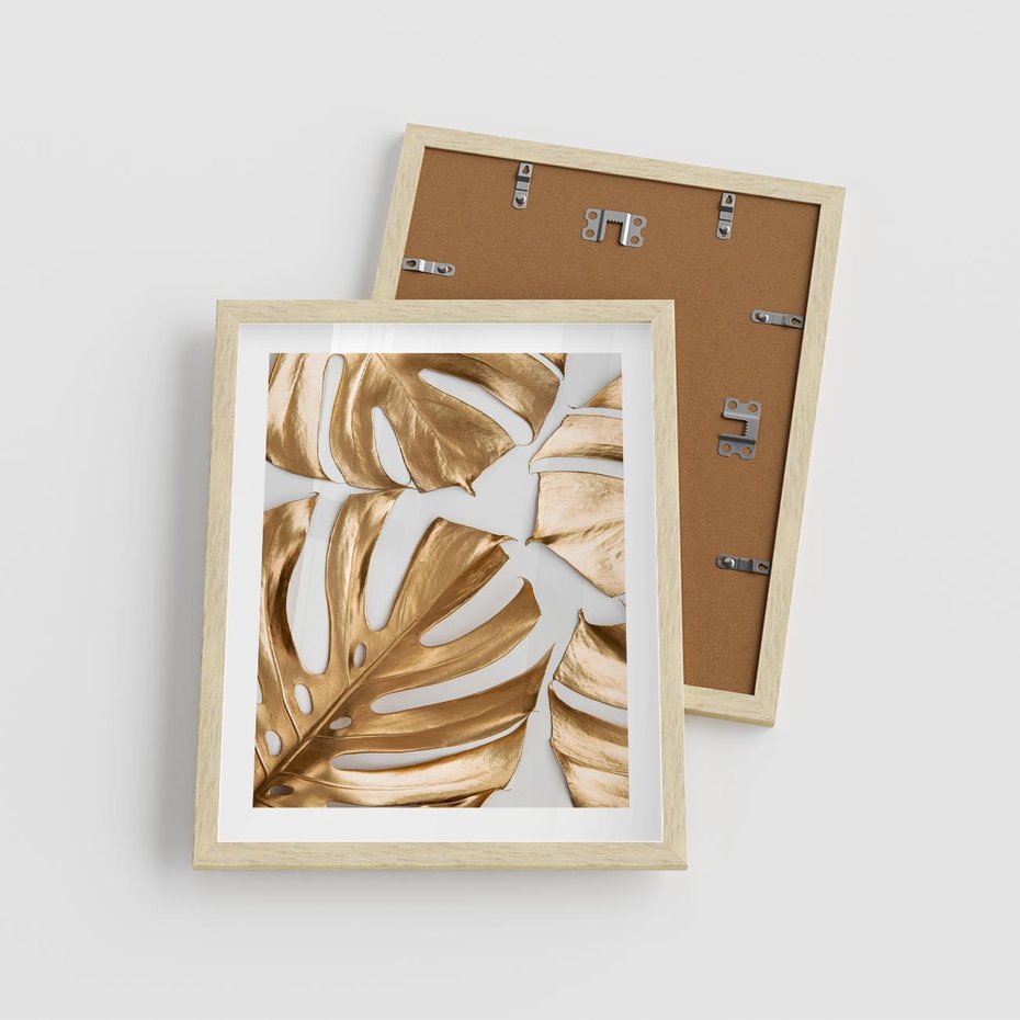 Plakat w ramie 40x50 - Złote Akcenty w Fotografii - złotel liście monstery, na białym tle - rama drewno