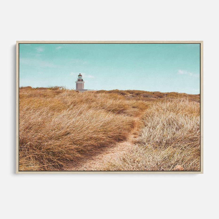 Obraz w ramie 100x70 - Tajemnicza Ścieżka - latarnia morska w oddali, suche trawy - rama drewno