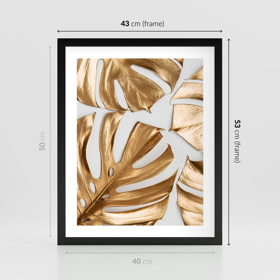 Plakat w ramie 40x50 - Złote Akcenty w Fotografii - złotel liście monstery, na białym tle - rama czarna