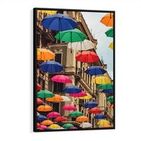 Obraz w ramie 50x70 - Barwna symfonia wyobraźni - fotografia, kolorowe parasolki podwieszone nad ulicą - rama czarna