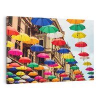 Obraz na płótnie 120x80 - Barwna symfonia wyobraźni - fotografia, kolorowe parasolki podwieszone nad ulicą